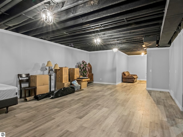 basement with hardwood / wood-style flooring