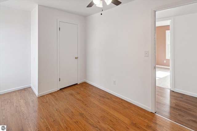 empty room featuring light hardwood / wood-style floors and ceiling fan