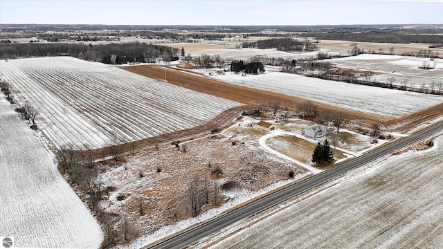 snowy aerial view with a rural view