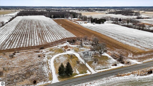 snowy aerial view with a rural view