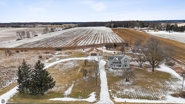 snowy aerial view with a rural view