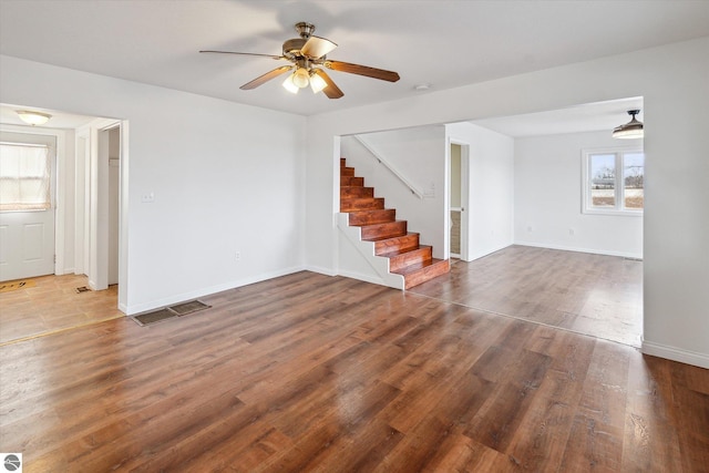 spare room featuring ceiling fan and dark hardwood / wood-style floors