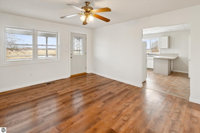 interior space featuring light hardwood / wood-style flooring and ceiling fan