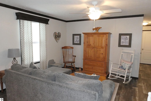 living room with crown molding, ceiling fan, dark hardwood / wood-style floors, and a wealth of natural light