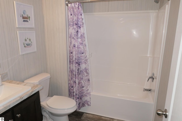 full bathroom featuring shower / tub combo with curtain, vanity, and toilet