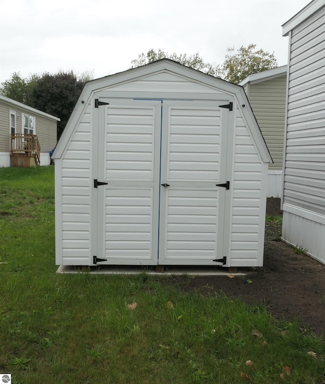 view of outdoor structure with a lawn