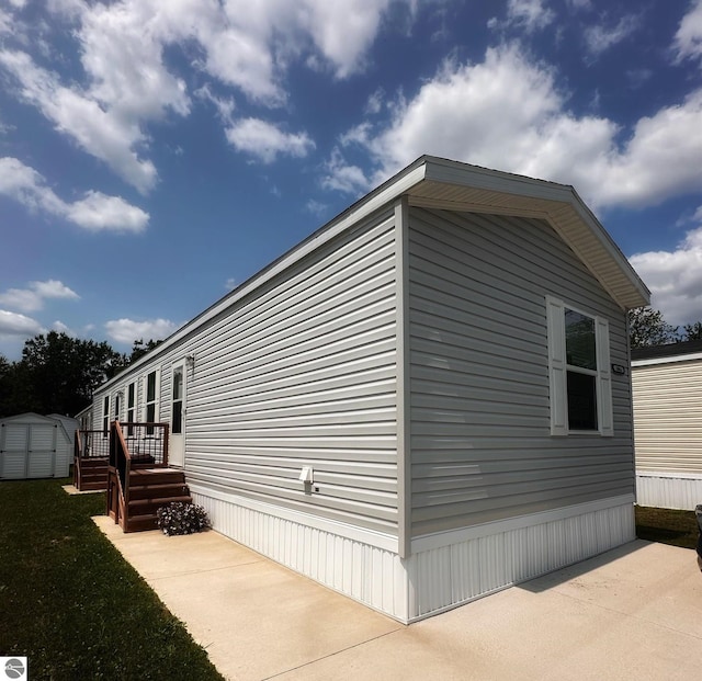 view of side of home featuring a patio