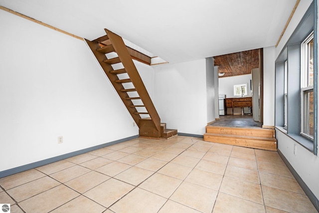 unfurnished living room with light tile patterned floors