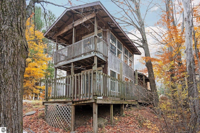 back of property featuring a deck