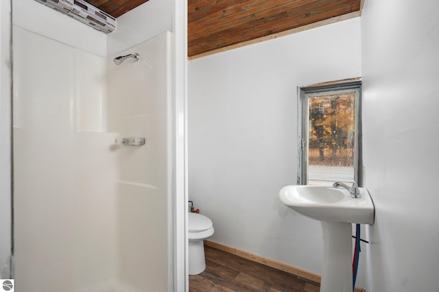 bathroom with wood-type flooring, sink, wooden ceiling, and toilet