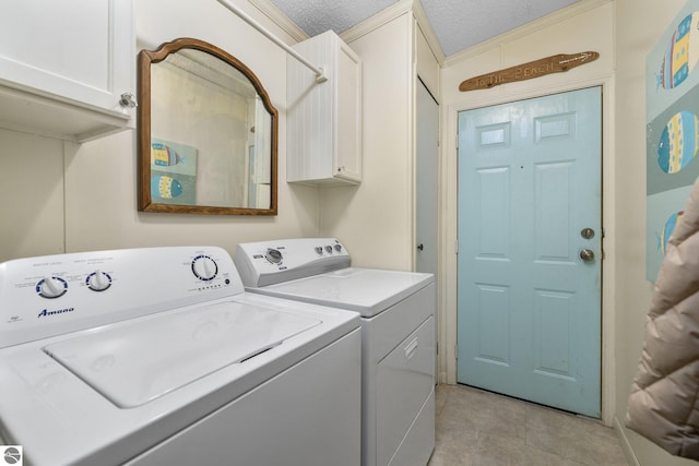 clothes washing area featuring cabinets, light tile patterned floors, a textured ceiling, and independent washer and dryer