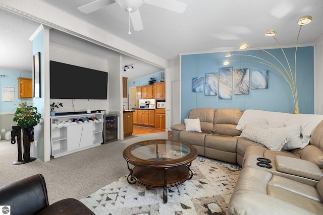 carpeted living room featuring ceiling fan, vaulted ceiling with beams, wine cooler, and a textured ceiling