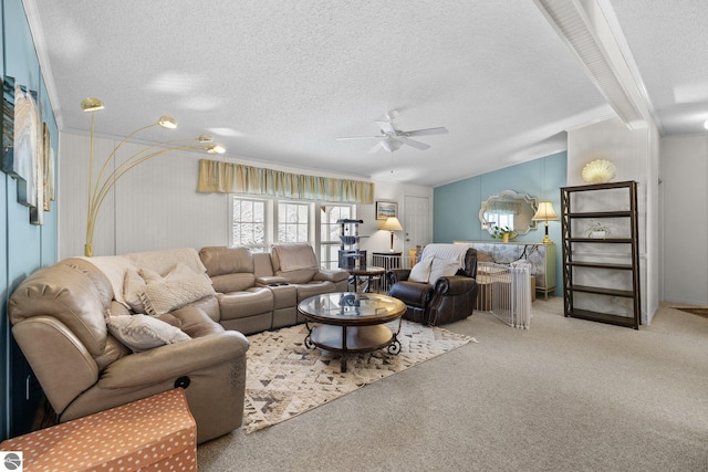 living room with ceiling fan, carpet floors, lofted ceiling with beams, and a textured ceiling