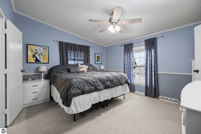 bedroom with crown molding, ceiling fan, a textured ceiling, light carpet, and vaulted ceiling