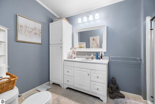 bathroom featuring vanity, crown molding, a textured ceiling, and toilet