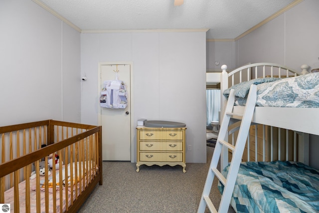 carpeted bedroom featuring crown molding and a textured ceiling