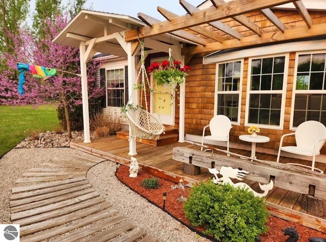 exterior space featuring a pergola and a deck