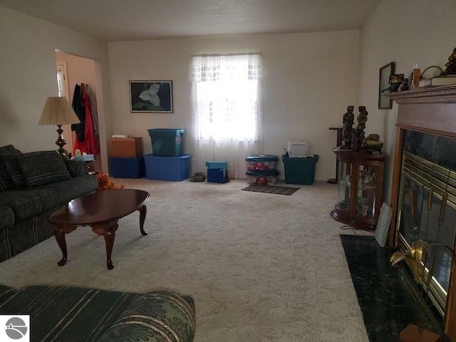 carpeted living room with a fireplace