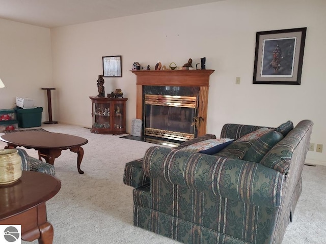 living room with light colored carpet and a fireplace