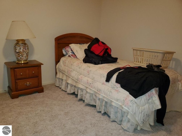 bedroom with light colored carpet