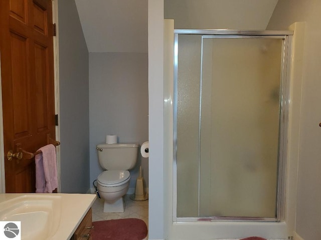 full bath with toilet, tile patterned flooring, a shower stall, and vanity