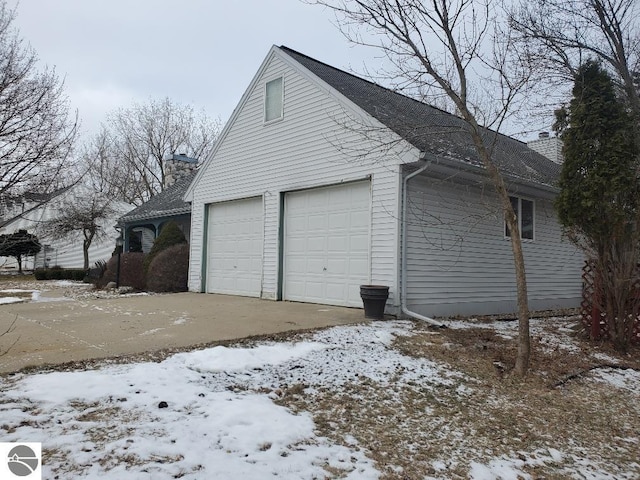 view of snow covered garage