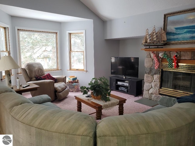 carpeted living room featuring vaulted ceiling and a fireplace