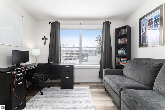 office space with light hardwood / wood-style flooring