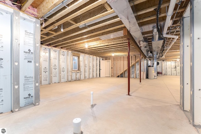 basement featuring gas water heater