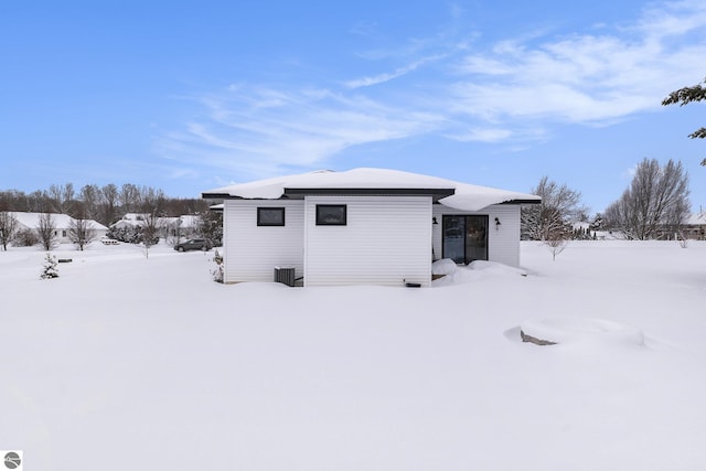 view of snow covered house