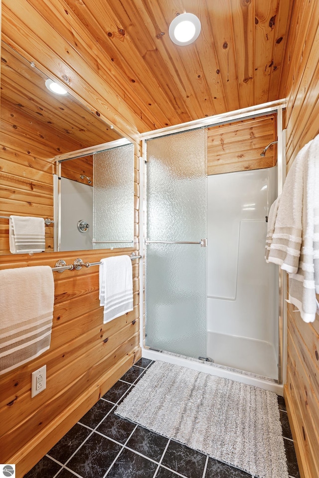 bathroom with wooden walls and wood ceiling