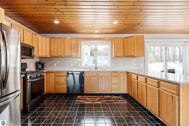 kitchen with sink, light stone countertops, wooden ceiling, and appliances with stainless steel finishes