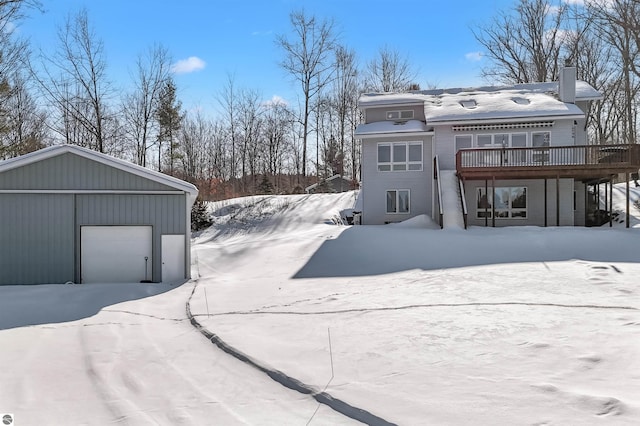 exterior space with a wooden deck and a garage