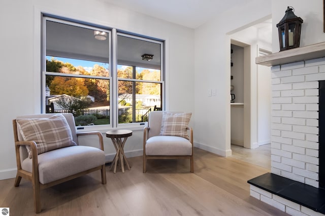 living area with light hardwood / wood-style flooring