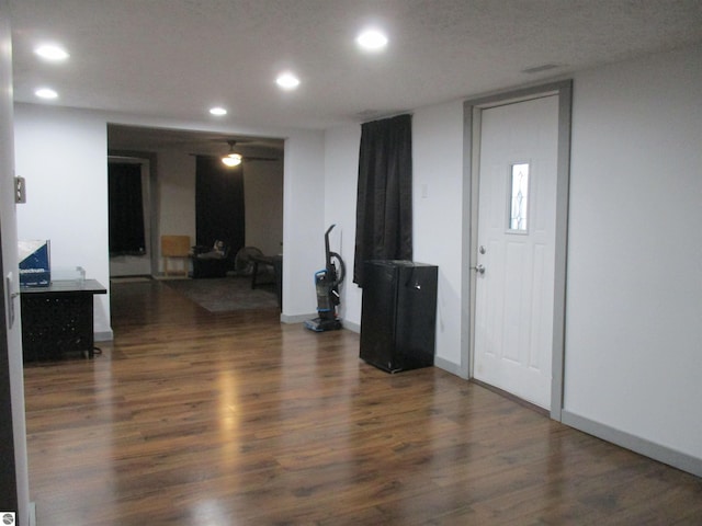 entryway with dark hardwood / wood-style floors