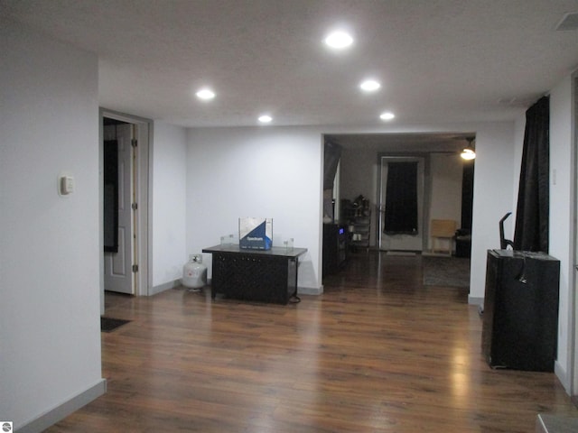 corridor featuring dark hardwood / wood-style flooring