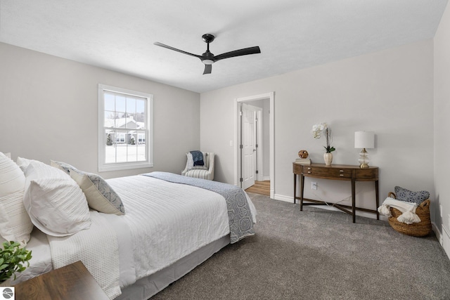 carpeted bedroom with baseboards and ceiling fan