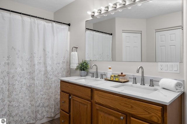 bathroom featuring double vanity and a sink