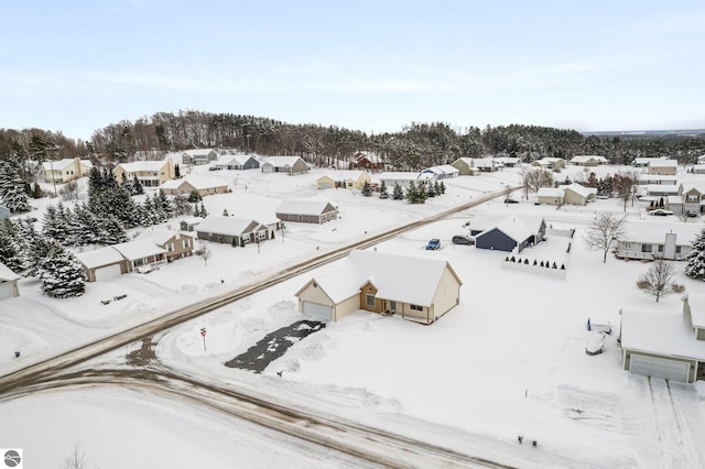 snowy aerial view featuring a residential view