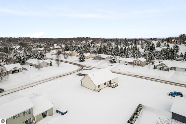 snowy aerial view featuring a residential view