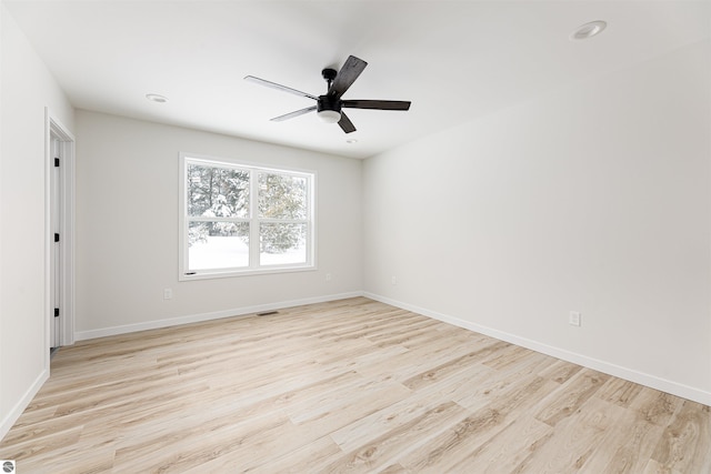 unfurnished room with light hardwood / wood-style flooring and ceiling fan