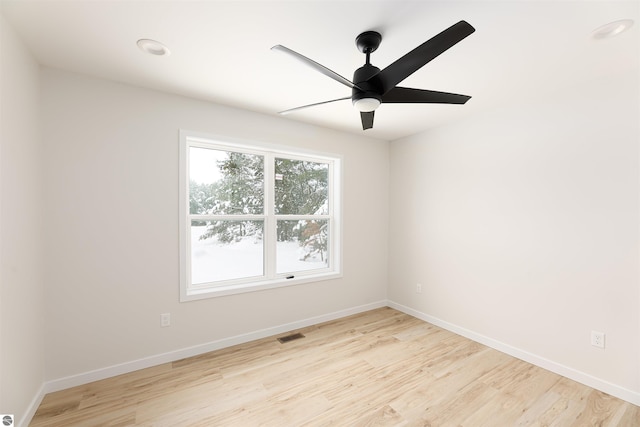 unfurnished room featuring ceiling fan and light hardwood / wood-style floors