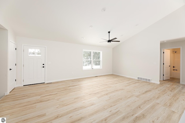 unfurnished living room featuring ceiling fan, light hardwood / wood-style floors, and vaulted ceiling