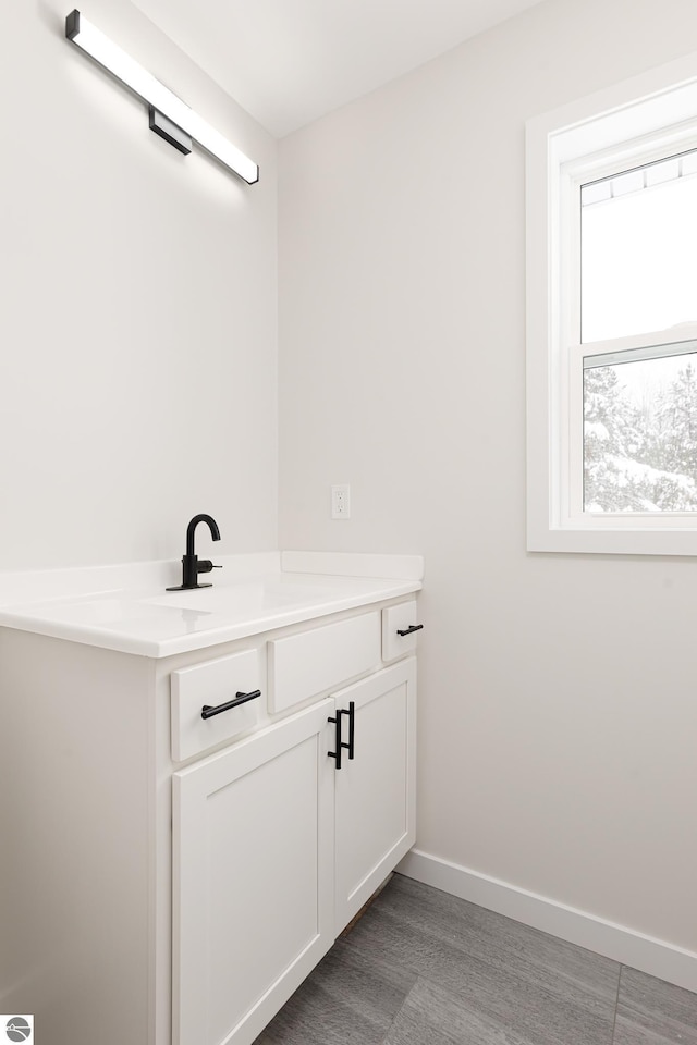 bathroom featuring vanity and hardwood / wood-style floors