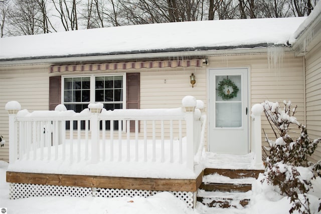 view of snow covered property entrance