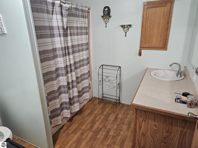 bathroom with vanity and hardwood / wood-style floors