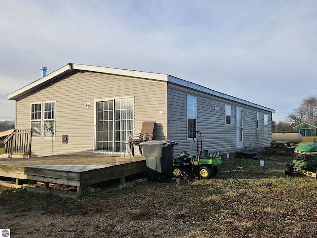 rear view of house with a deck