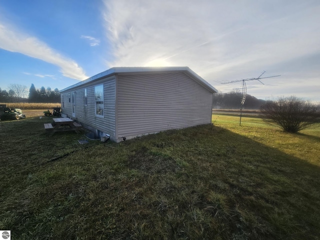 view of home's exterior featuring a yard