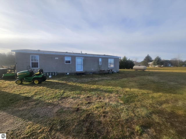 back of house with a yard