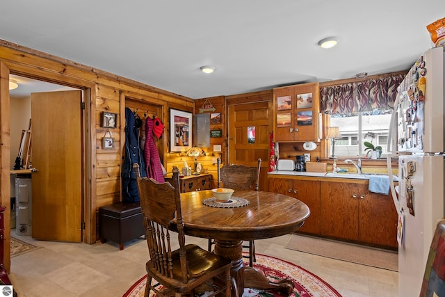 dining area with wood walls